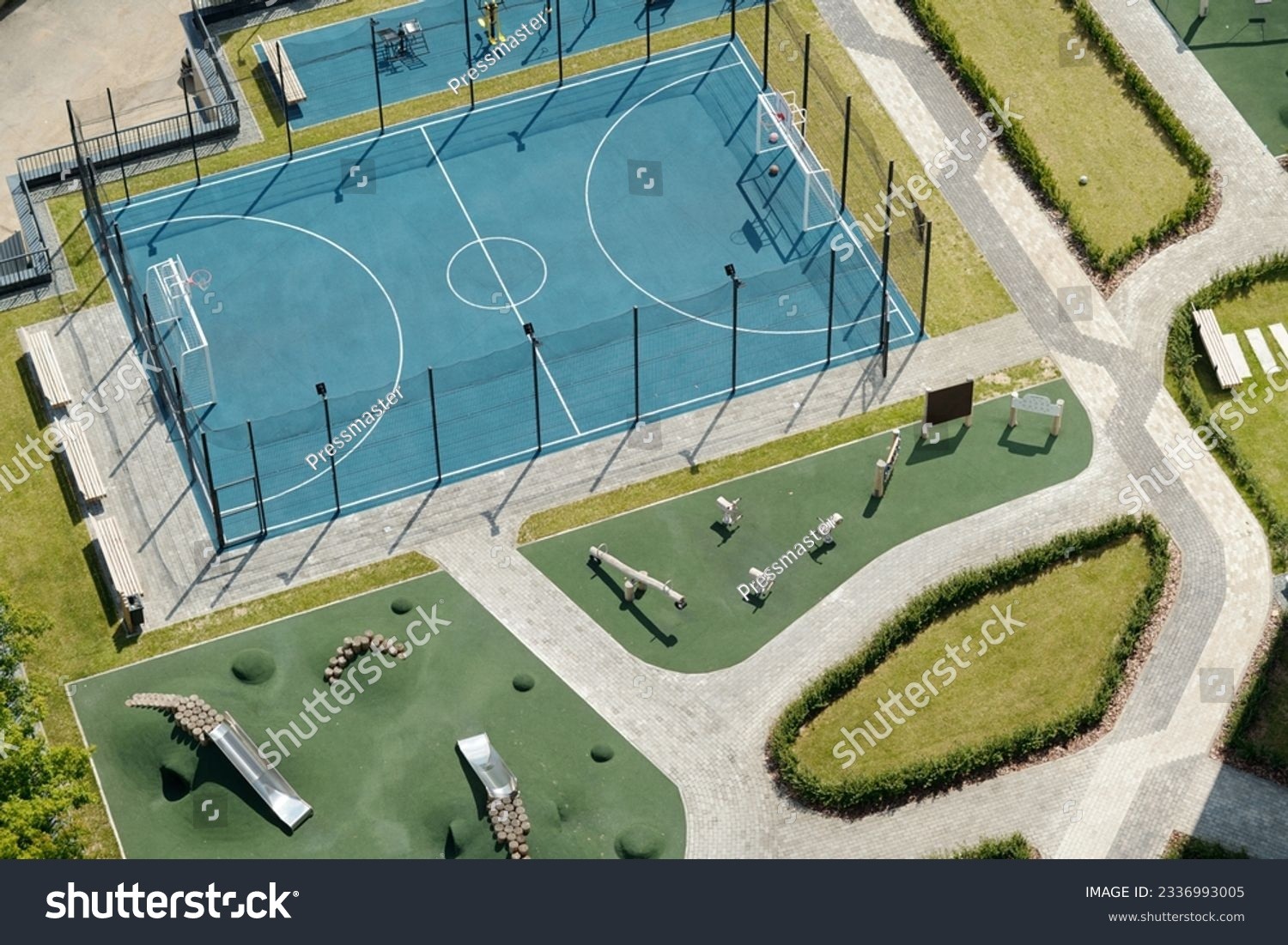 stock-photo-high-angle-of-part-of-large-yard-with-modern-sports-ground-for-playing-football-basketball-and-2336993005